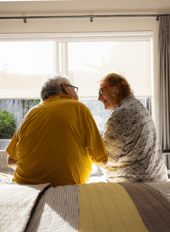 Image of two elderly people talking to each other